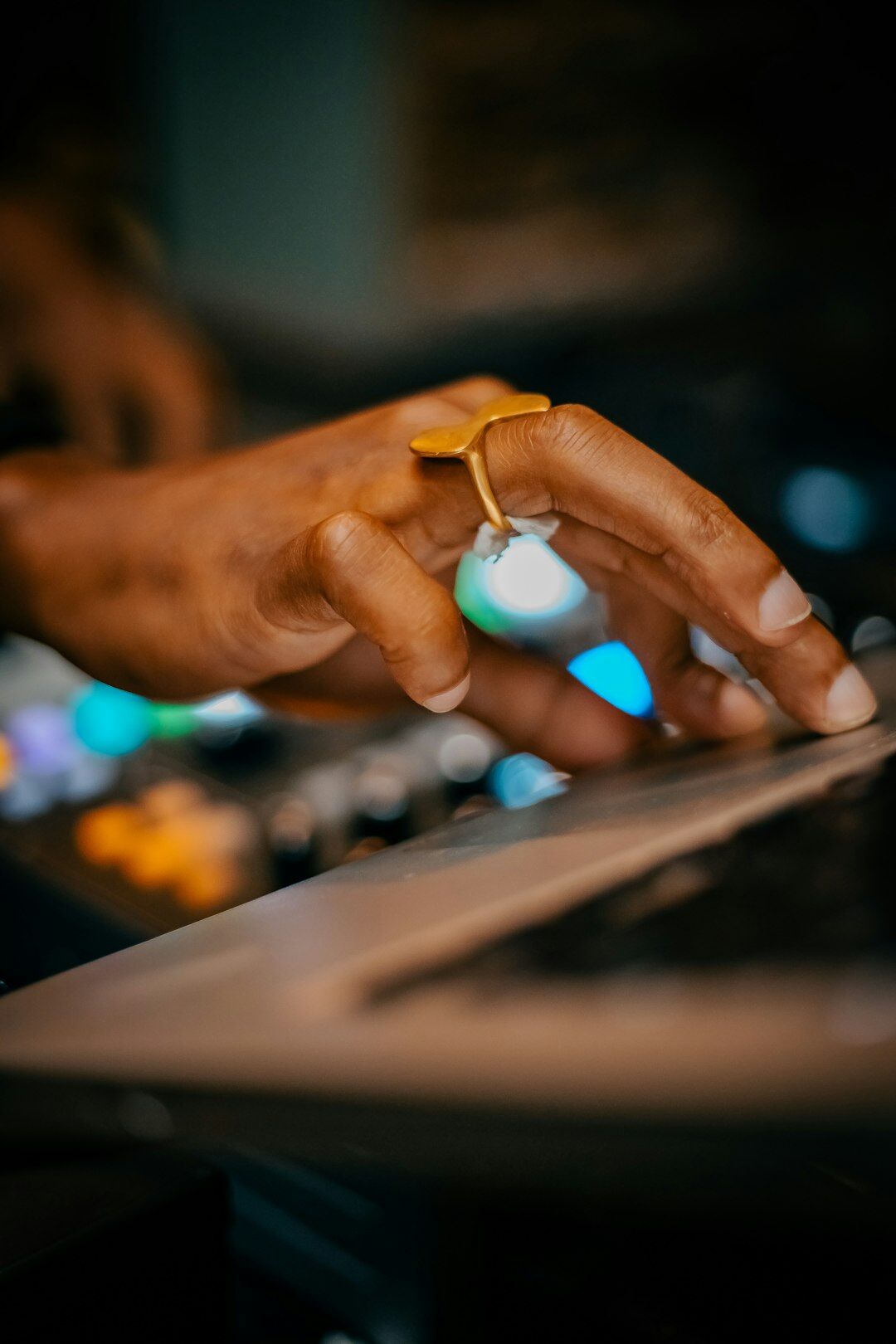 Vision mixer hands operating a switcher during live broadcast